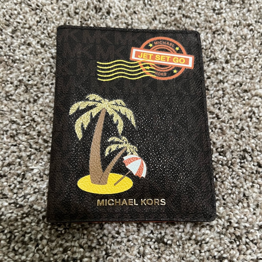 Authentic Michael Kors Passport/CCD Holder wallet.